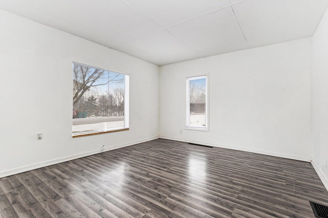 empty room featuring dark hardwood / wood-style floors