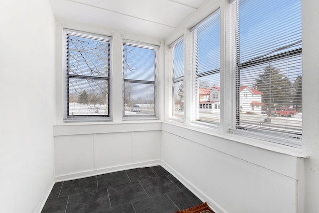 unfurnished sunroom featuring plenty of natural light