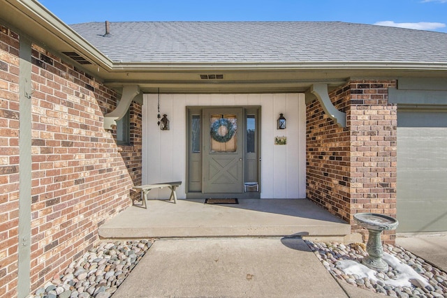 property entrance with a garage