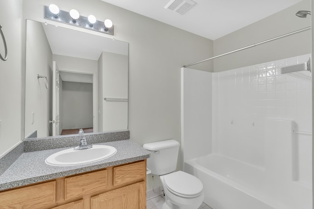 full bathroom with vanity, toilet, and  shower combination