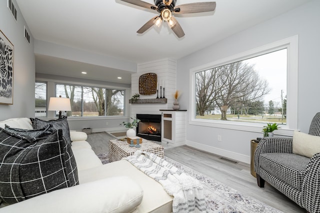 6735 S Scottdale Rd, Berrien Springs, MI 49103 - living room featuring visible vents, baseboards, and wood finished floors