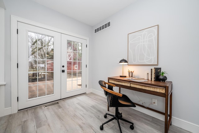 6735 S Scottdale Rd, Berrien Springs, MI 49103 - office area featuring baseboards, visible vents, wood finished floors, and french doors