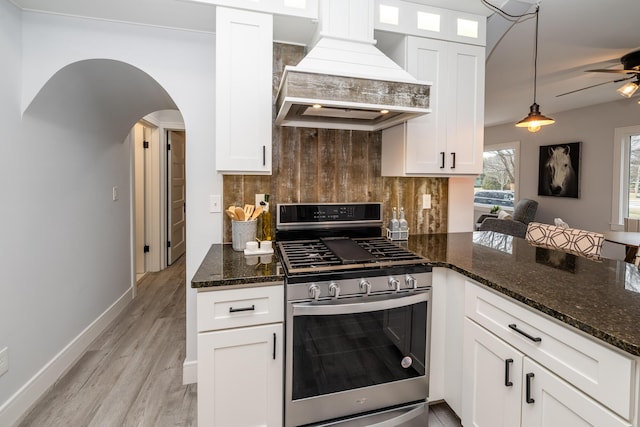 6735 S Scottdale Rd, Berrien Springs, MI 49103 - kitchen featuring backsplash, dark stone countertops, custom exhaust hood, and gas range