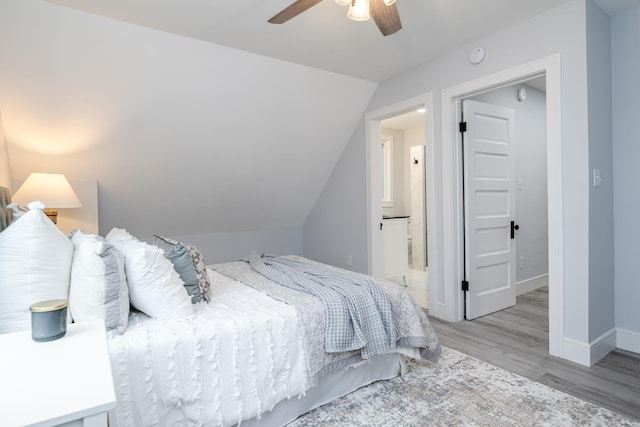 6735 S Scottdale Rd, Berrien Springs, MI 49103 - bedroom featuring ensuite bathroom, ceiling fan, vaulted ceiling, wood finished floors, and baseboards