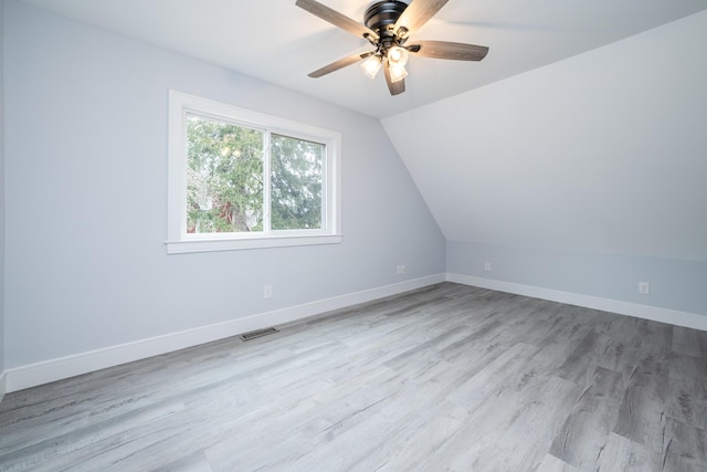 6735 S Scottdale Rd, Berrien Springs, MI 49103 - additional living space with wood finished floors, a ceiling fan, visible vents, vaulted ceiling, and baseboards