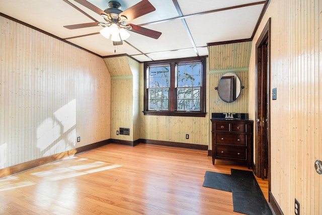 bonus room with ceiling fan and light wood-type flooring