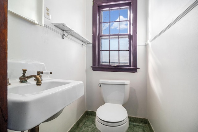 bathroom with sink and toilet