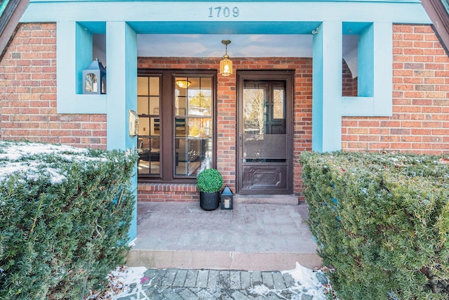 doorway to property with a porch