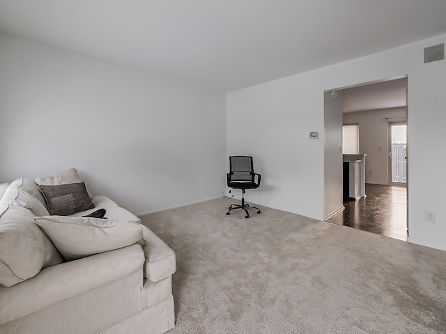 sitting room featuring carpet flooring