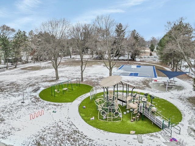 view of property's community with a playground and a lawn