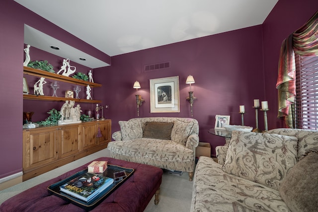 living room featuring carpet floors and visible vents