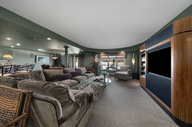 carpeted living room with recessed lighting and ornate columns