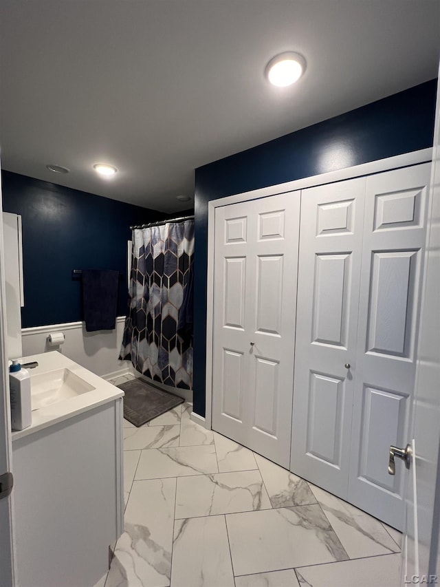 bathroom featuring vanity and walk in shower