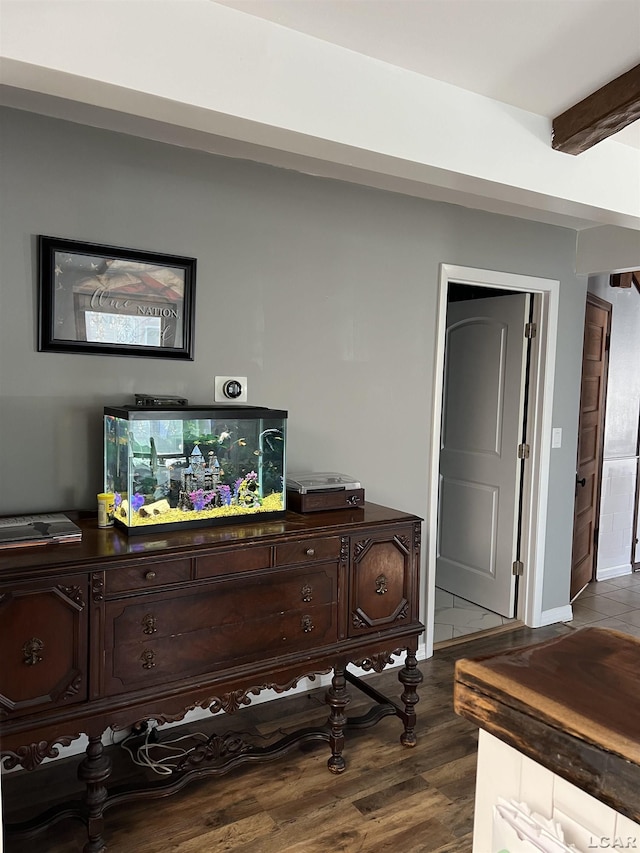 interior space featuring hardwood / wood-style floors and beam ceiling