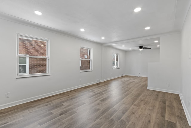 unfurnished room with wood-type flooring and ceiling fan