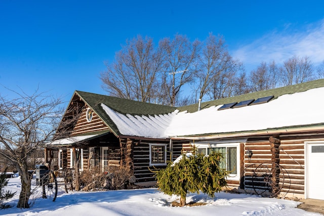 view of snow covered property