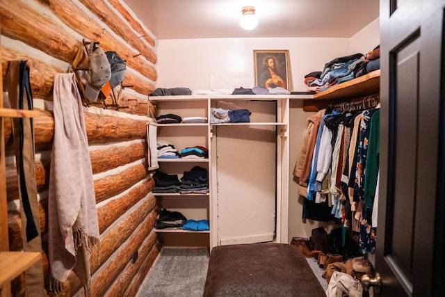 spacious closet with carpet flooring