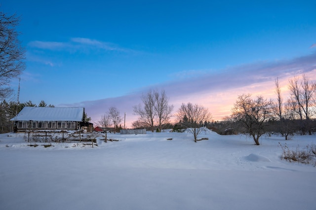 view of yard layered in snow