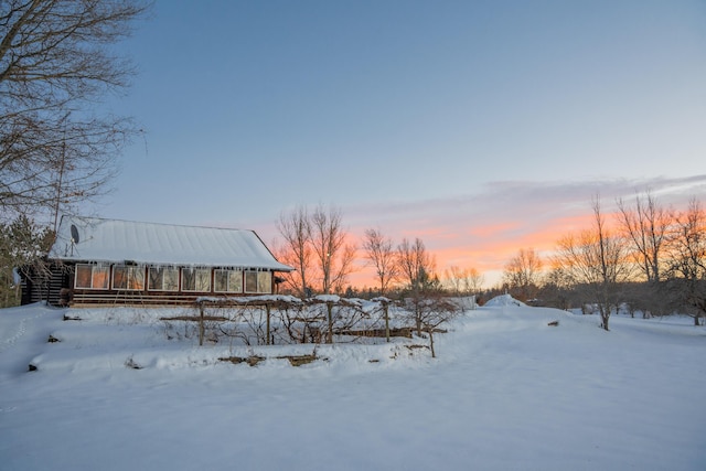 view of yard layered in snow