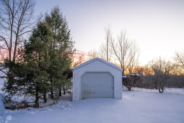 view of snow covered garage