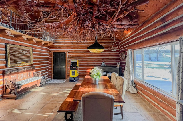 tiled dining room with high vaulted ceiling