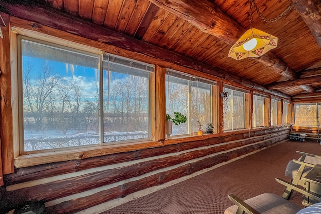 interior space featuring wood ceiling and beam ceiling