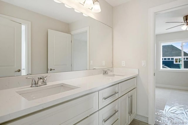 bathroom with ceiling fan and vanity