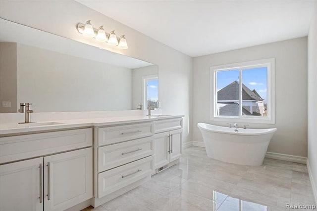 bathroom with vanity and a bathtub