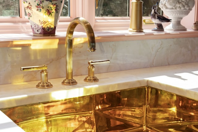 details featuring sink and backsplash