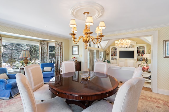 dining space with a chandelier and crown molding