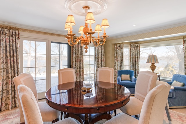 dining room featuring crown molding and a notable chandelier