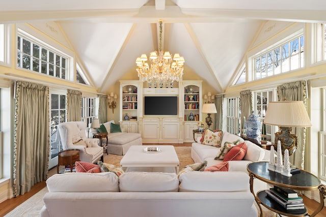 living room with light hardwood / wood-style flooring, a chandelier, and high vaulted ceiling