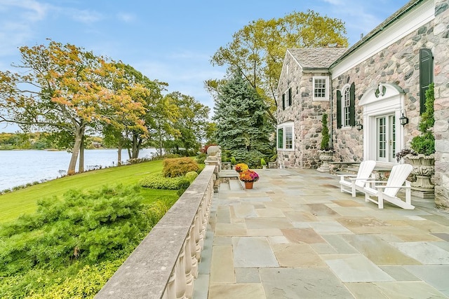 view of patio with a water view