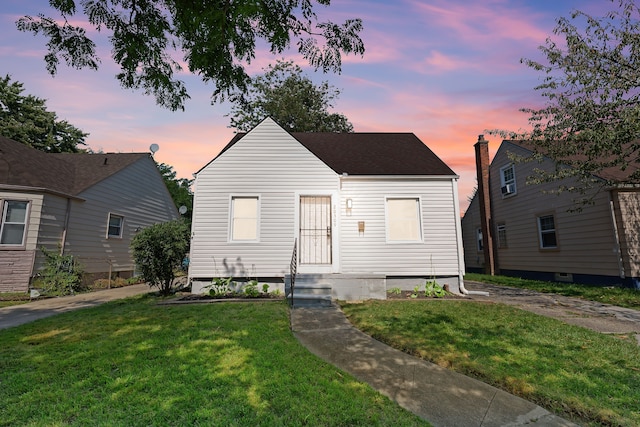 view of front of property with a yard