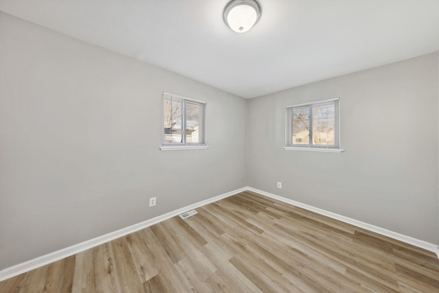 unfurnished room featuring light hardwood / wood-style floors