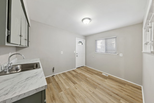 interior space featuring sink and light wood-type flooring