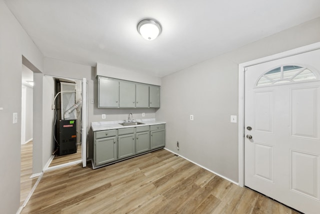 kitchen with sink and light wood-type flooring