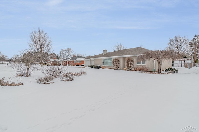 view of yard layered in snow