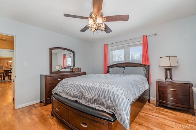 bedroom featuring ceiling fan and light hardwood / wood-style flooring