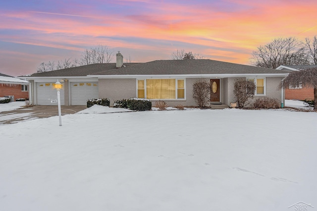 single story home featuring a garage