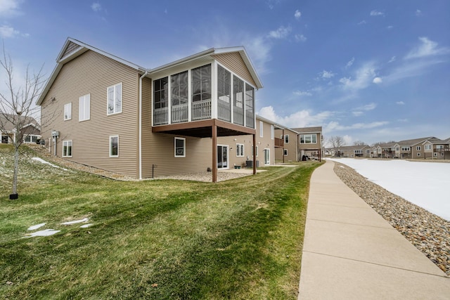 3774 Bungalow Path Unit 32, Saint Joseph, MI 49085 - view of side of home featuring a yard and a sunroom
