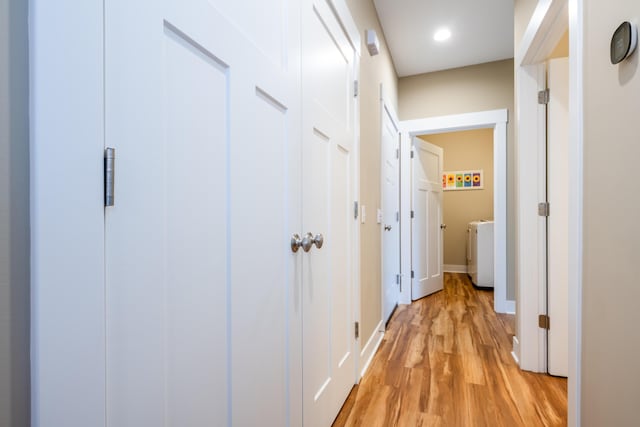 3774 Bungalow Path Unit 32, Saint Joseph, MI 49085 - hallway featuring separate washer and dryer and light wood-type flooring