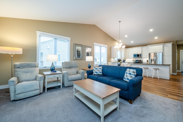 3774 Bungalow Path Unit 32, Saint Joseph, MI 49085 - living room with lofted ceiling, light hardwood / wood-style flooring, and a notable chandelier