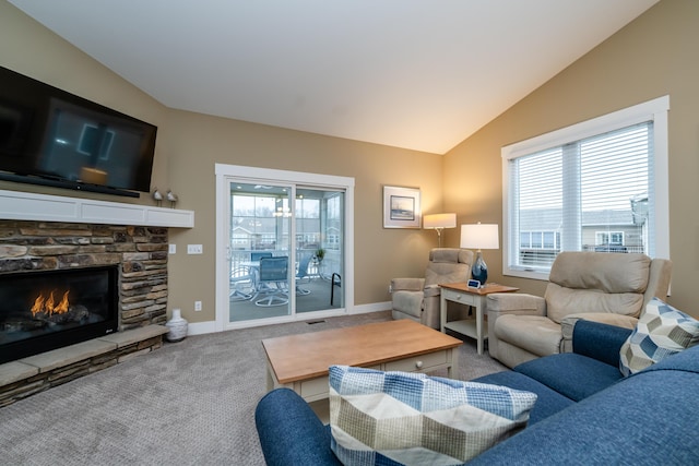 3774 Bungalow Path Unit 32, Saint Joseph, MI 49085 - carpeted living room featuring lofted ceiling, a stone fireplace, and plenty of natural light