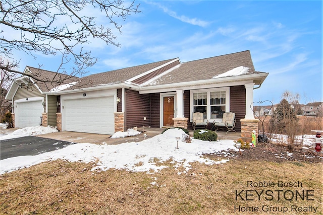 view of front of home with a garage and covered porch