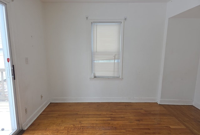 30052 Schoenherr Rd, Warren, MI 48088 - empty room featuring wood finished floors, a wealth of natural light, and baseboards