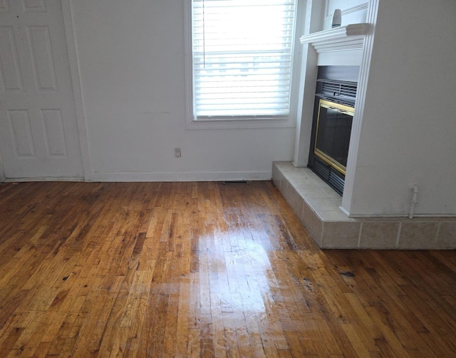 30052 Schoenherr Rd, Warren, MI 48088 - unfurnished living room with baseboards and wood-type flooring