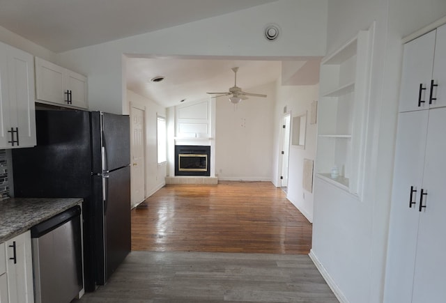 30052 Schoenherr Rd, Warren, MI 48088 - kitchen featuring wood finished floors, a glass covered fireplace, dishwasher, ceiling fan, and lofted ceiling
