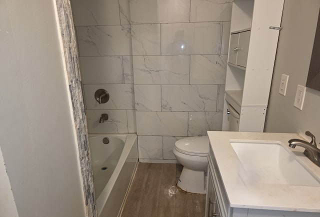 30052 Schoenherr Rd, Warren, MI 48088 - full bath featuring toilet, tile walls, shower / bathing tub combination, wood finished floors, and vanity
