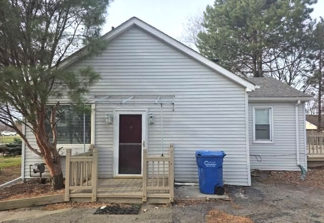 30052 Schoenherr Rd, Warren, MI 48088 - rear view of house featuring a shingled roof and a deck